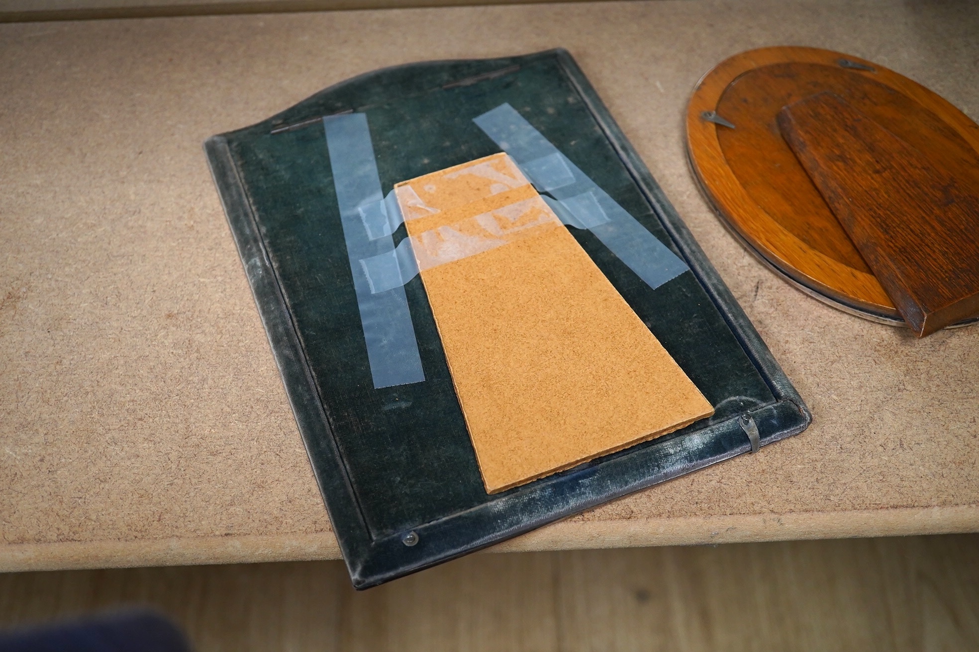 Two George V engine tuned silver mounted photograph frames, Birmingham, 1914, largest 25.1cm. Condition - fair